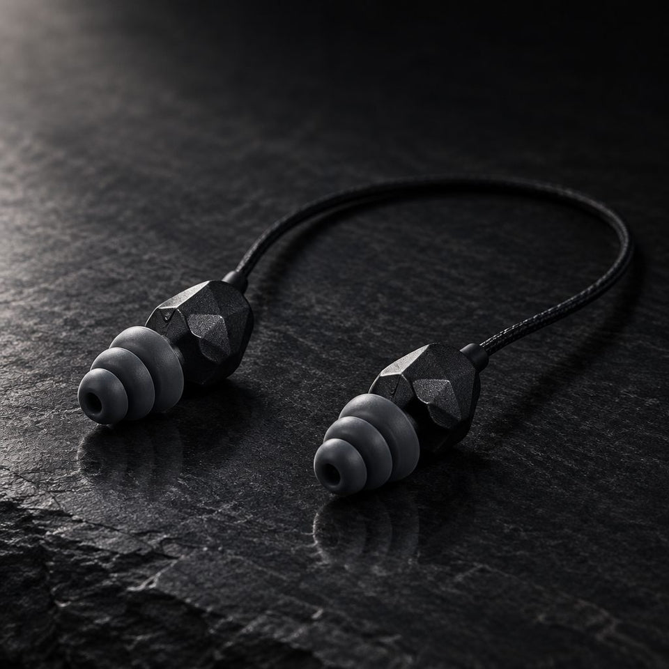 A molded pair of Fitplugs on a slate surface